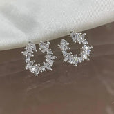 Brinco 0035 meio circulo pedras